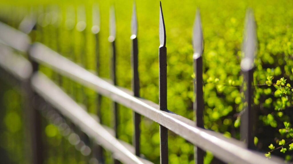 Metal security fence with decorative design