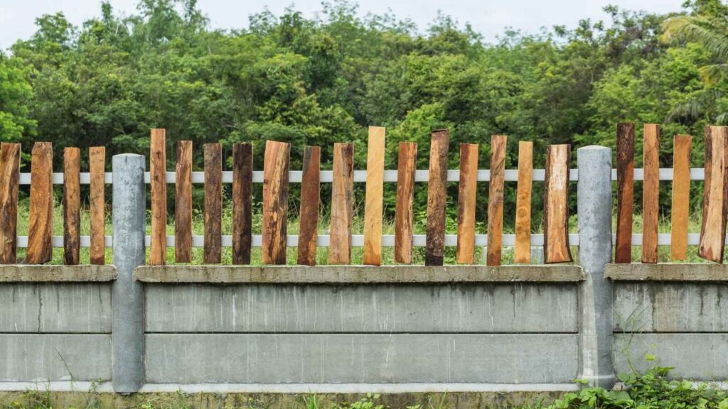 Wood fence with concrete posts for residential property